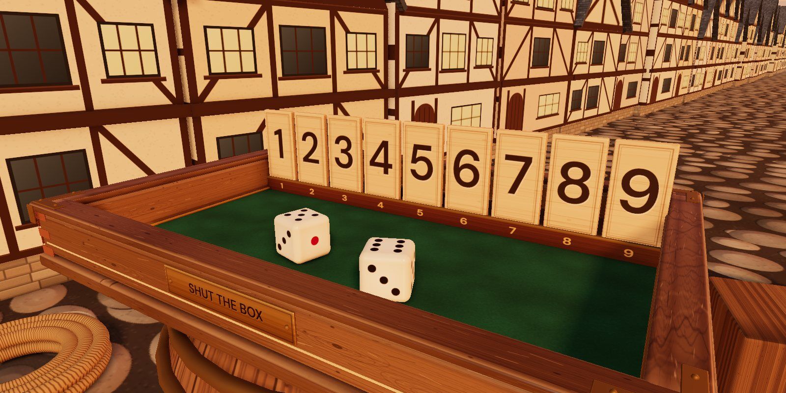 Tiles 1 to 9 standing in a wooden box, with houses behind